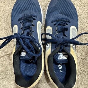 Nike Blue Athletic Shoes with Breathable Mesh and White Accents